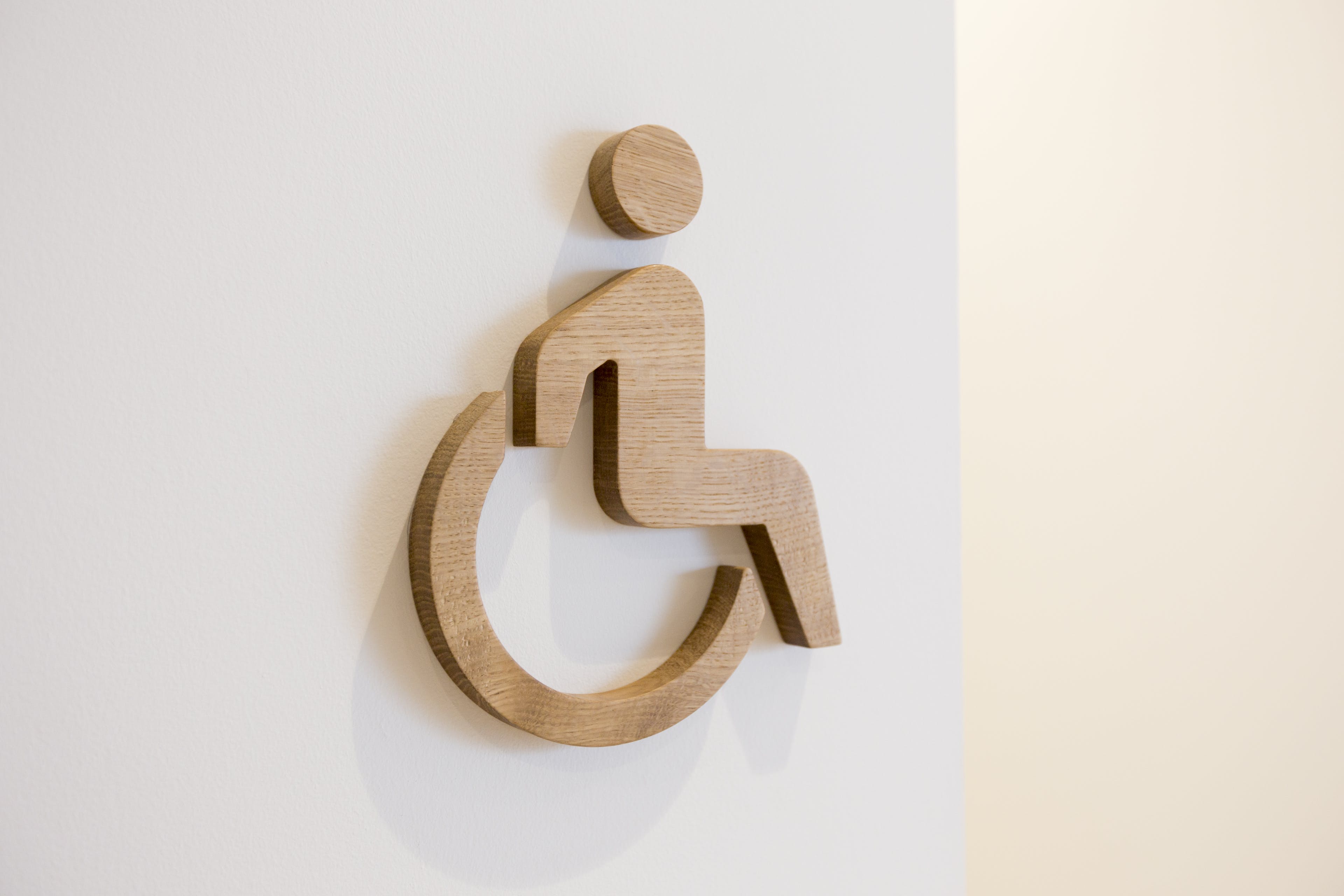 A wooden wheelchair icon